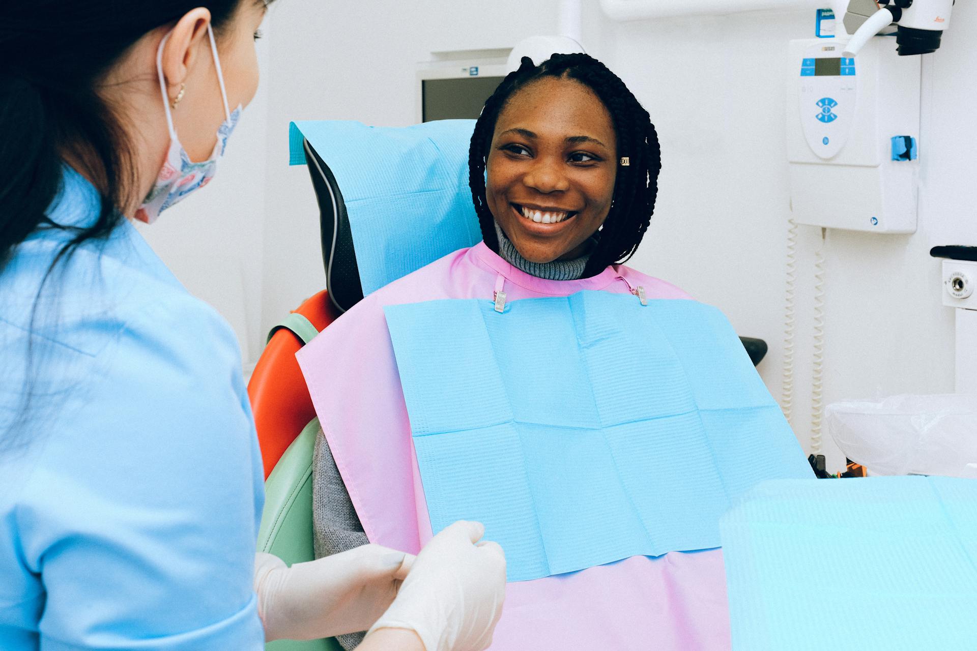 Smiling Patient at Dental Station